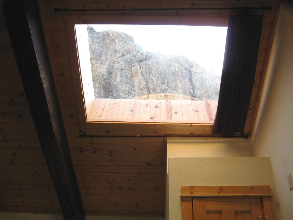 Skylight with mountain view features a retractable curtain