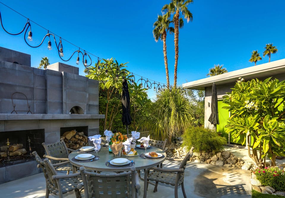 Enchanting outdoor dining grotto with wood burning fireplace and seating for 8 