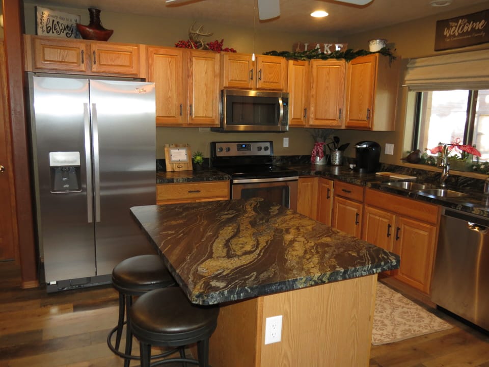 Kitchen showing new granite and new appliances.