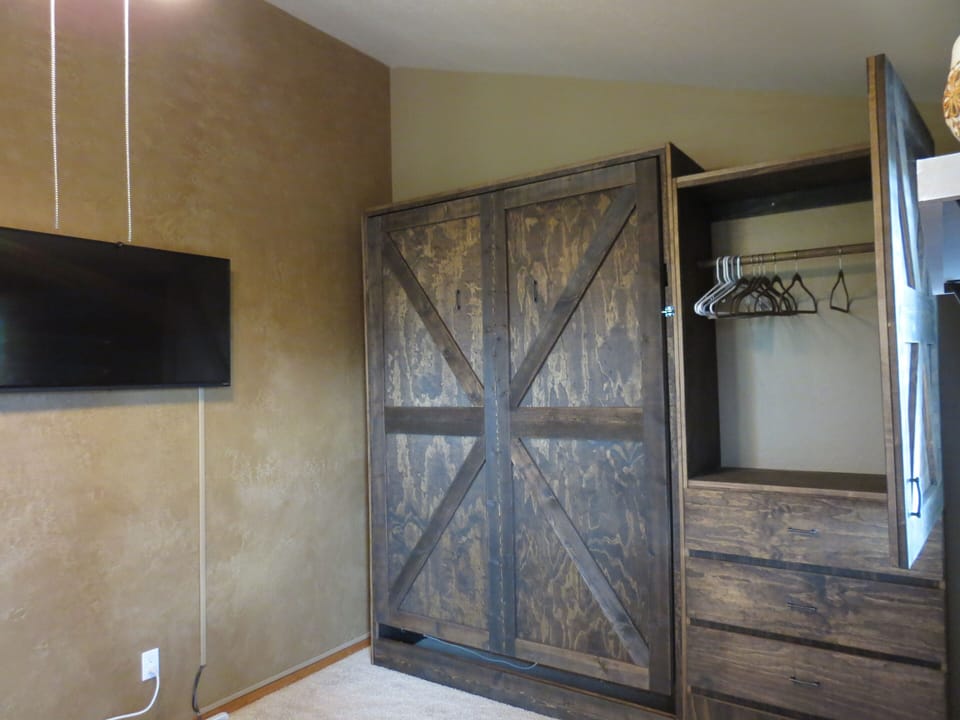 Loft with Murphy Bed up against the wall.