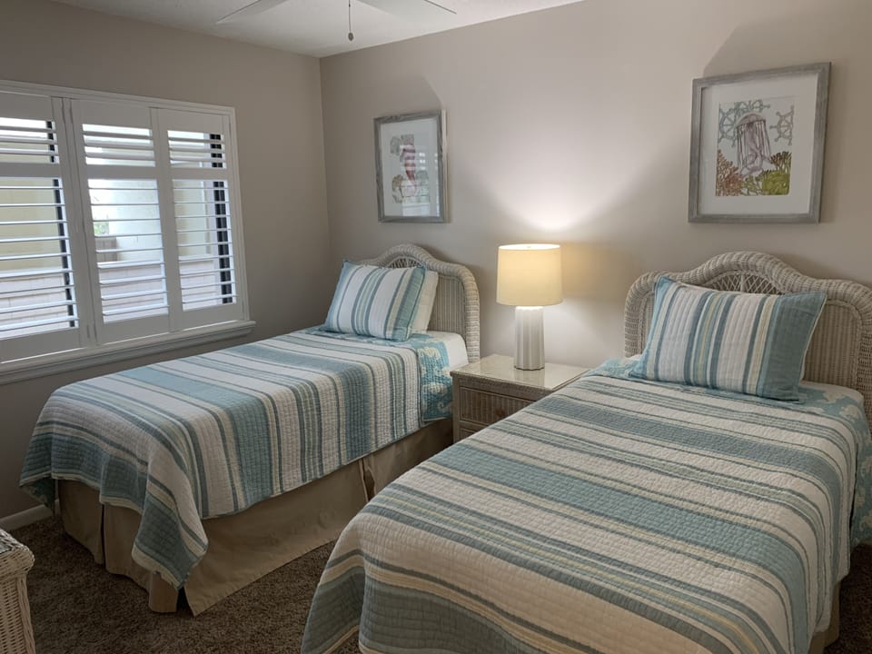 Twin beds in second bedroom.