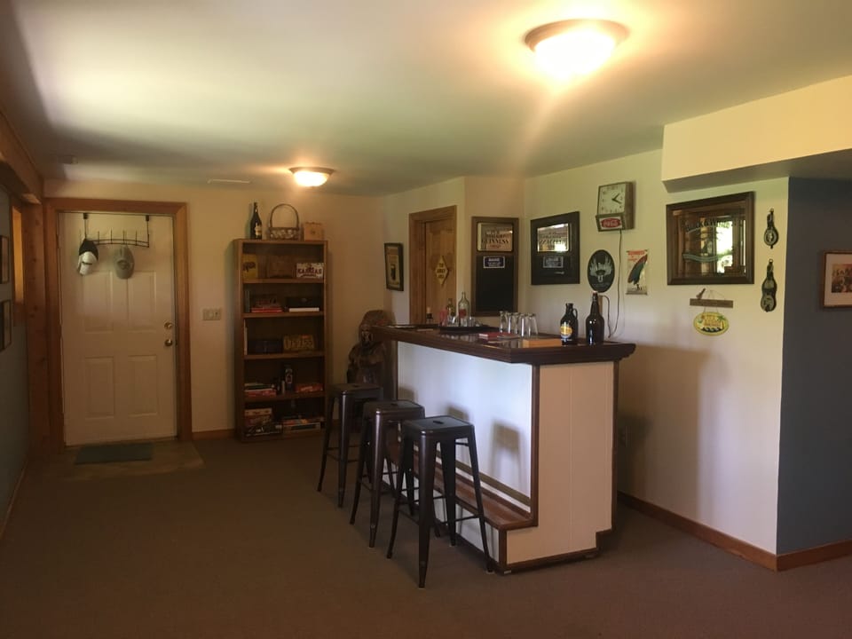 Lower floor with bar and large TV