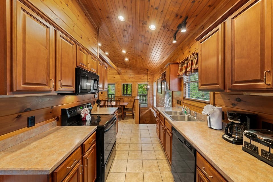 Kitchen Main Level - Fully stocked with pots, pans, dishes, utensils, coffee pot