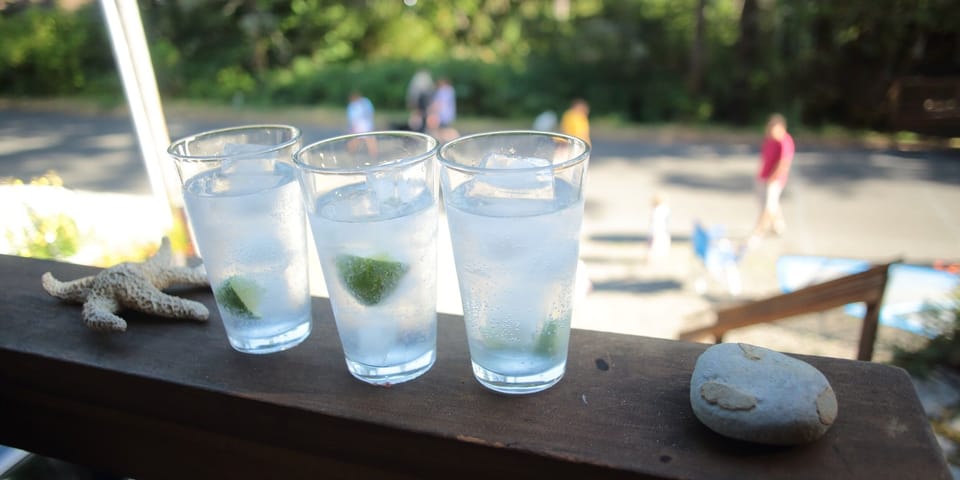 Cocktails on the front deck & watching the kids play paddle tennis.