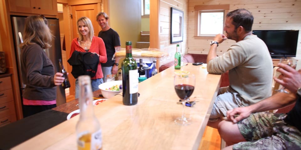 Friends arriving at Manzanita Summer Camp. Cocktails at the bar.