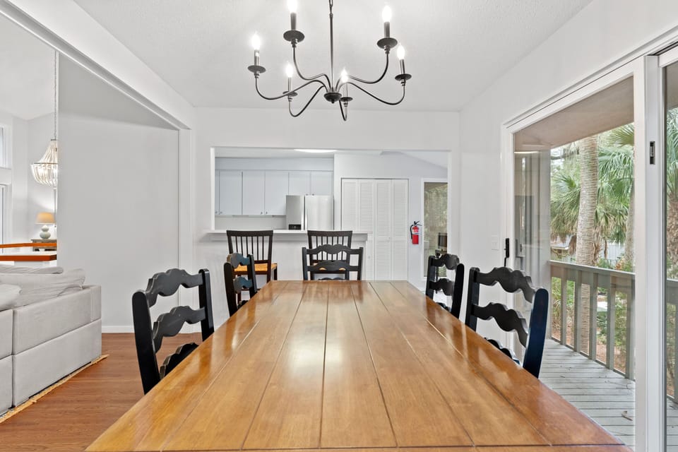 Dining room with 8 seats (1 seat is off to the side). Additional 2 seats available at kitchen countertop.