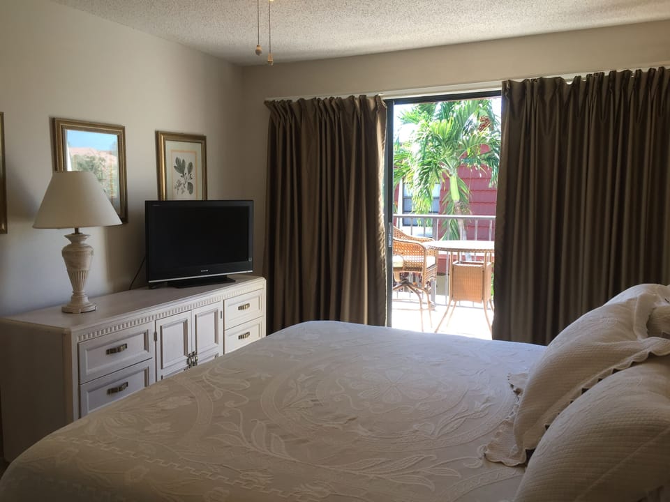 Master bedroom with sliding doors to balcony