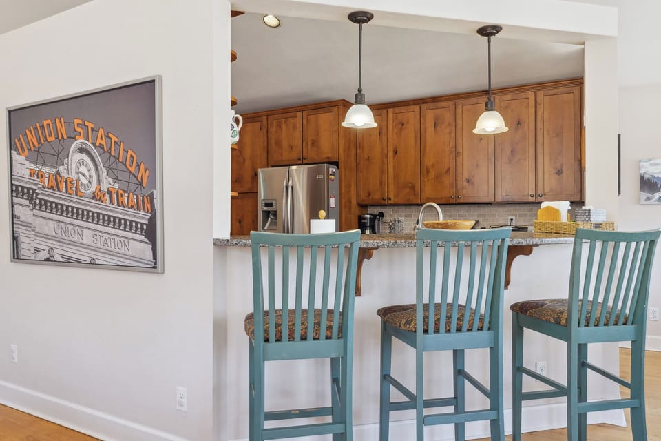 Bar chairs looking into kitchen
