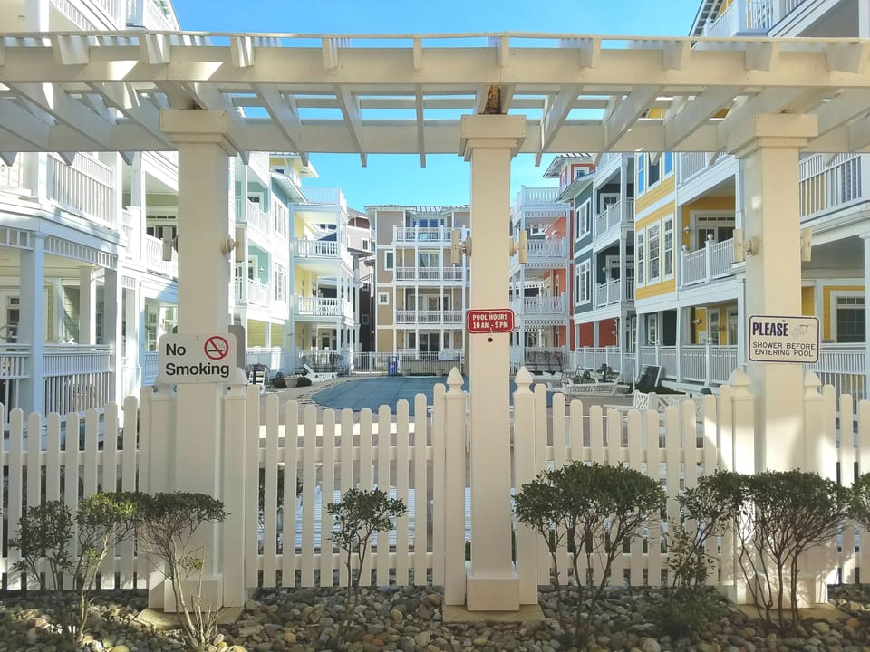Entrance to pool, jacuzz, kiddie pool and grill area
