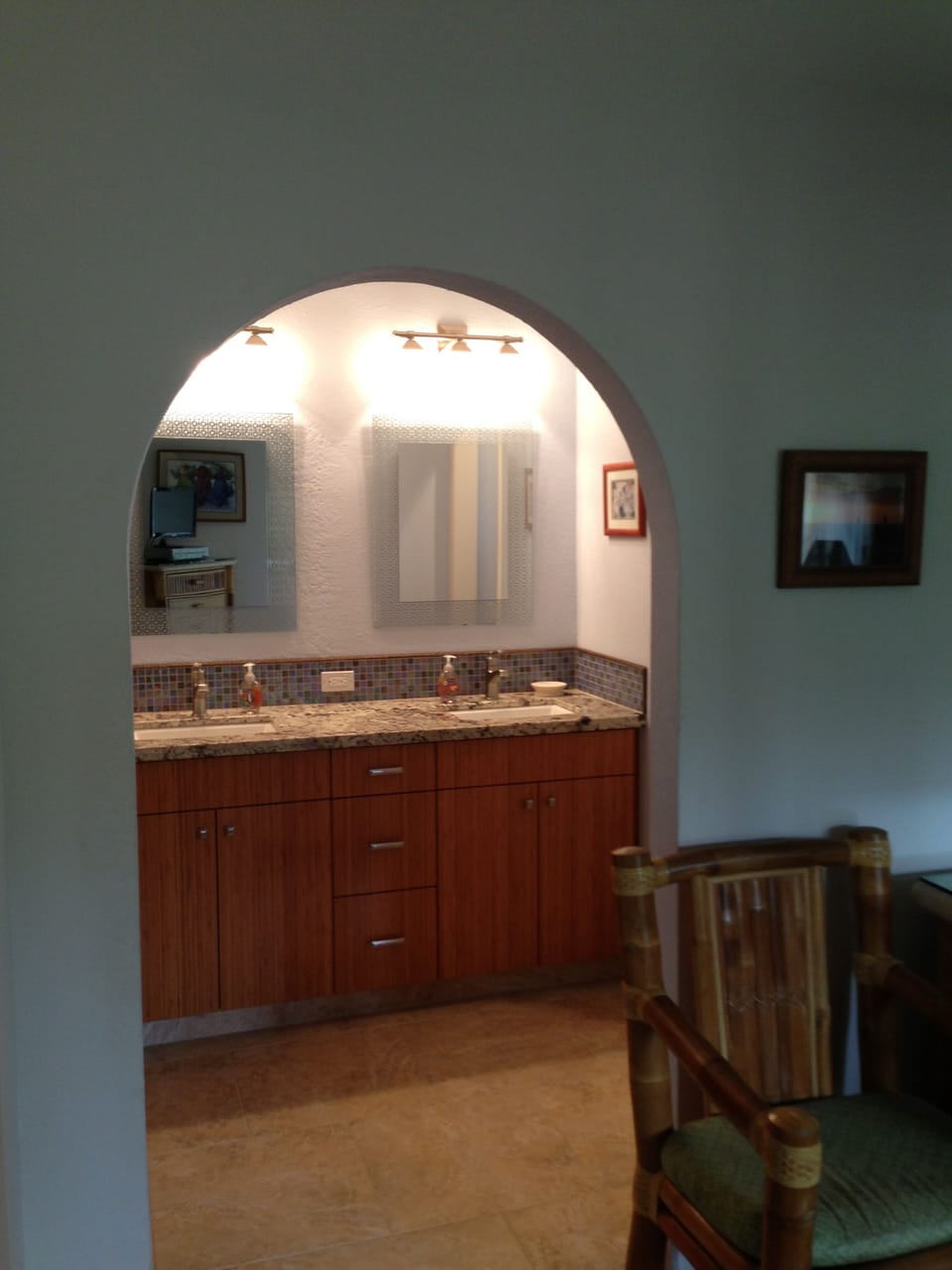 View from the master bedroom into the remodeled master bath with double sinks.