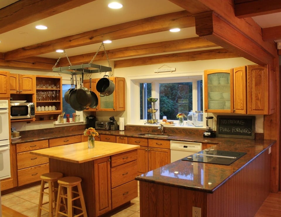 Fully equipped chef's kitchen with open floor plan to living room