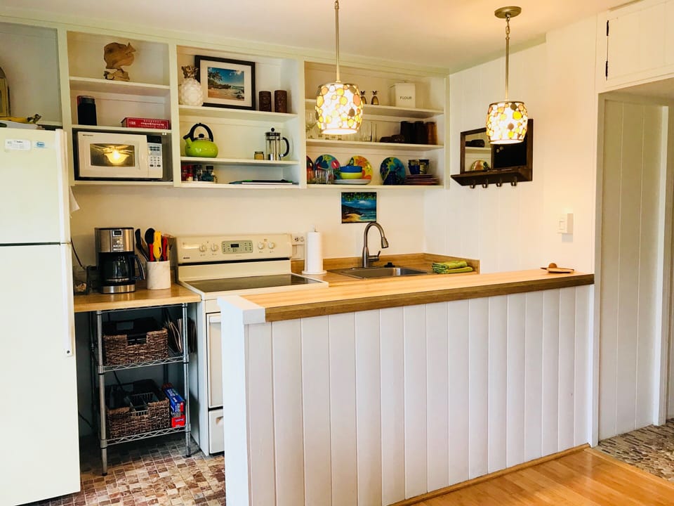 Updated kitchen with stove, oven, microwave and new coffee maker