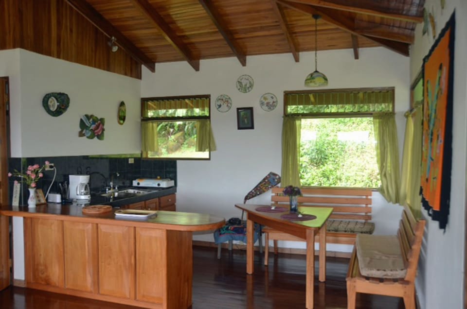Upstairs kitchenette breakfast bar with mini-fridge, stove-top