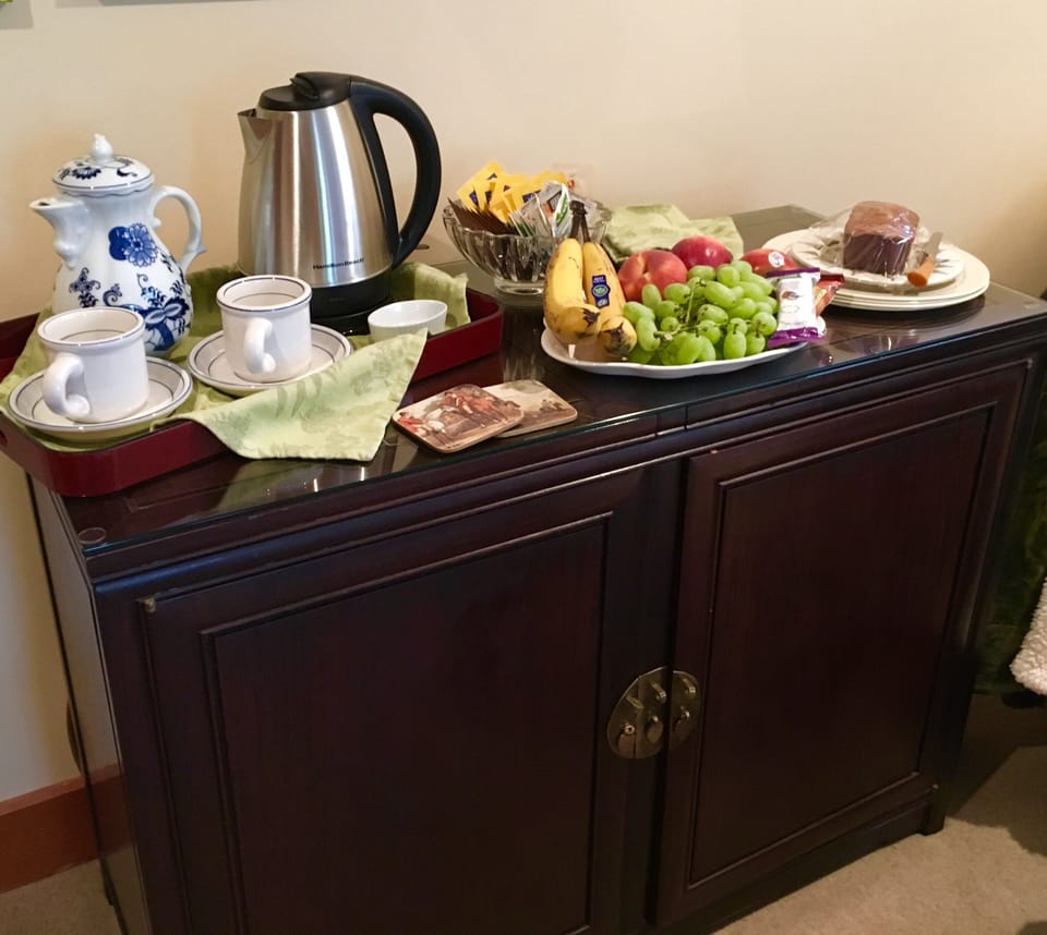Tea and treats table. Fresh fruit, energy bars and homemade banana bread. 