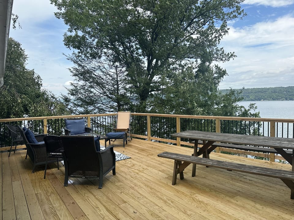 New upper deck with seating area, picnic table and BBQ.