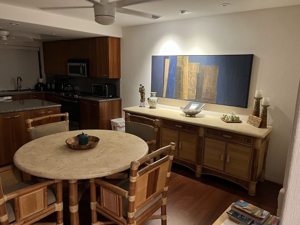 Indoor dining table can seat 4-6 for games or food. Fan & AC.