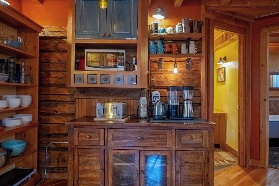 Coffee bar in fully equipped kitchen.  Bedroom and main floor bathroom access
