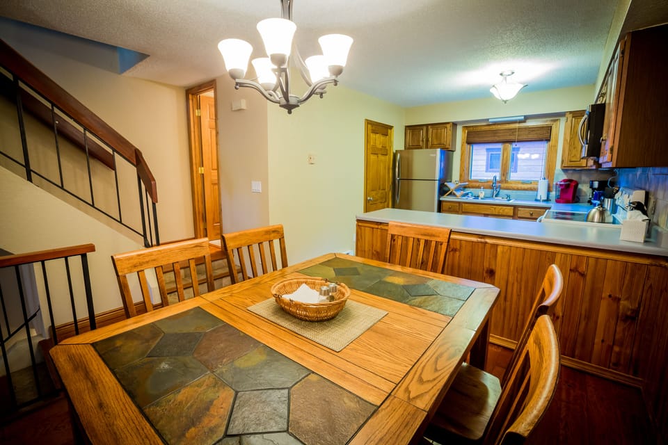 Dining & Kitchen-Washer/Dryer thru door next to fridge
Half-Bath, base of stairs