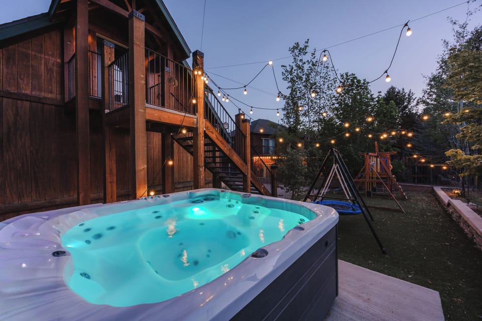 Soak beneath the stars in a private hot tub surrounded by glowing lights!