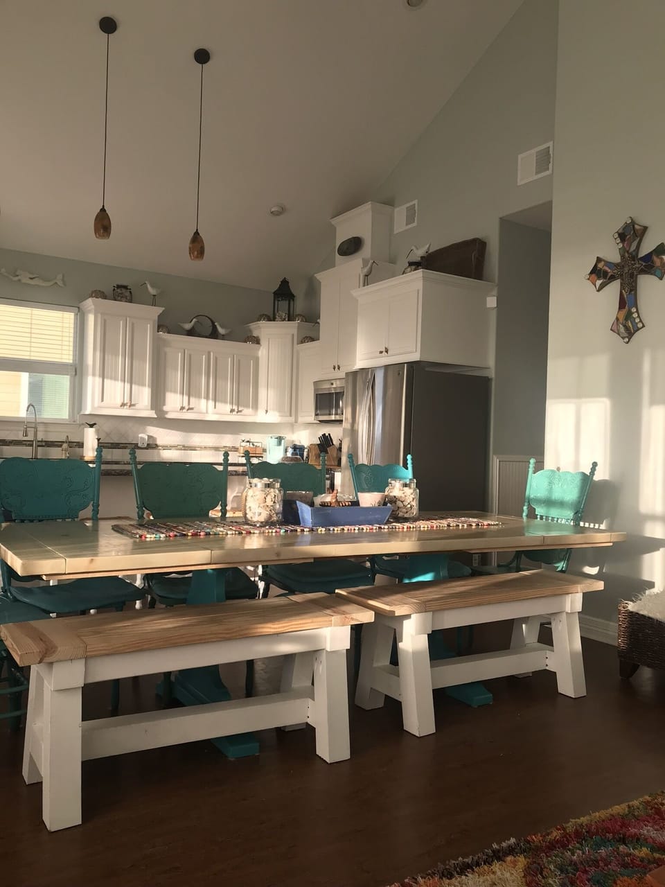 View of the amazing kitchen and 9 ft trestle table with seating for up to 12.  