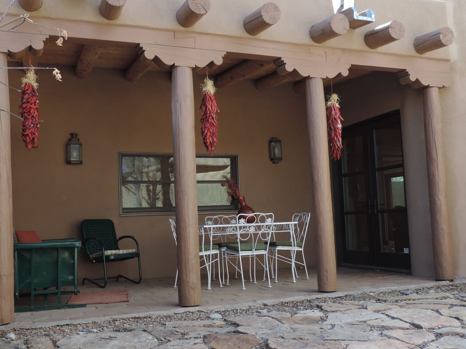 Front portal with additional seating and outdoor living area.
