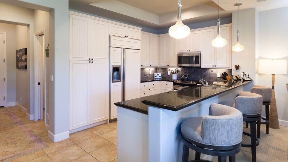 Kitchen with island seating for three
