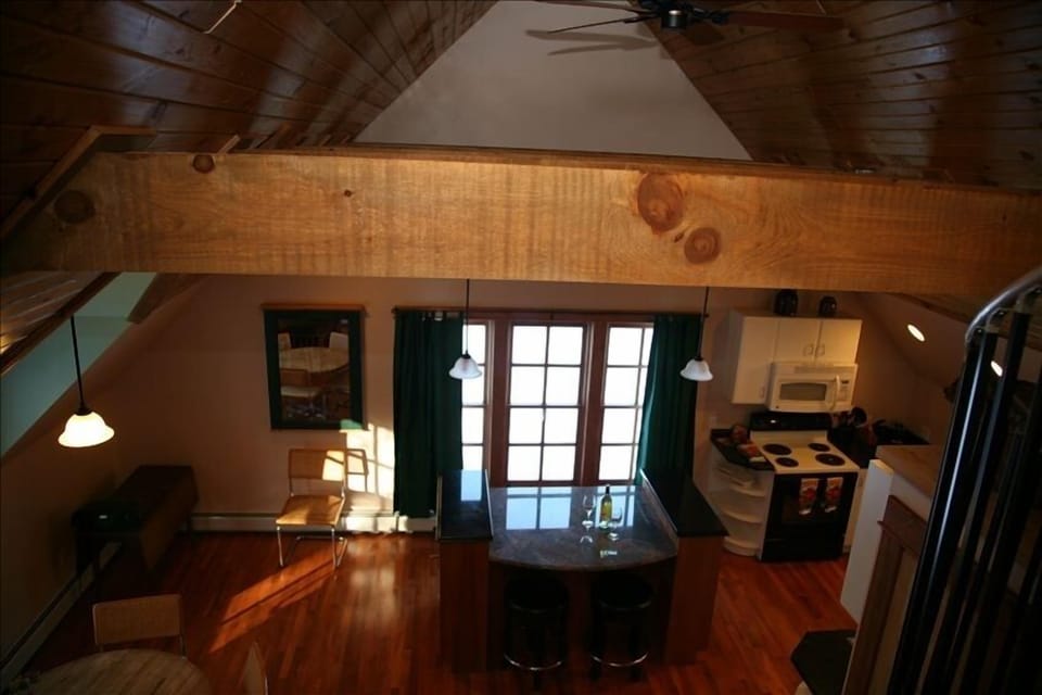 The apartment is open from the sleeping loft providing an owl's view.