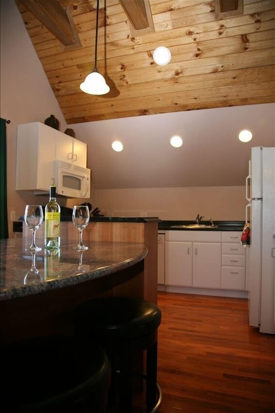 Breakfast island and fully equipped kitchen make cooking here fun.