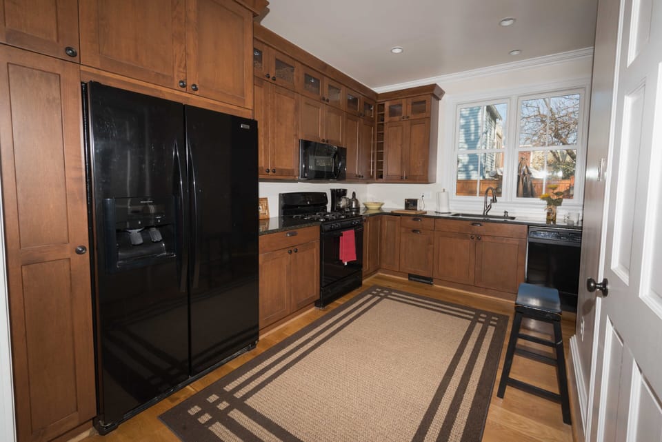Large kitchen ready for cooking.  All cookware is there and basic condiments.