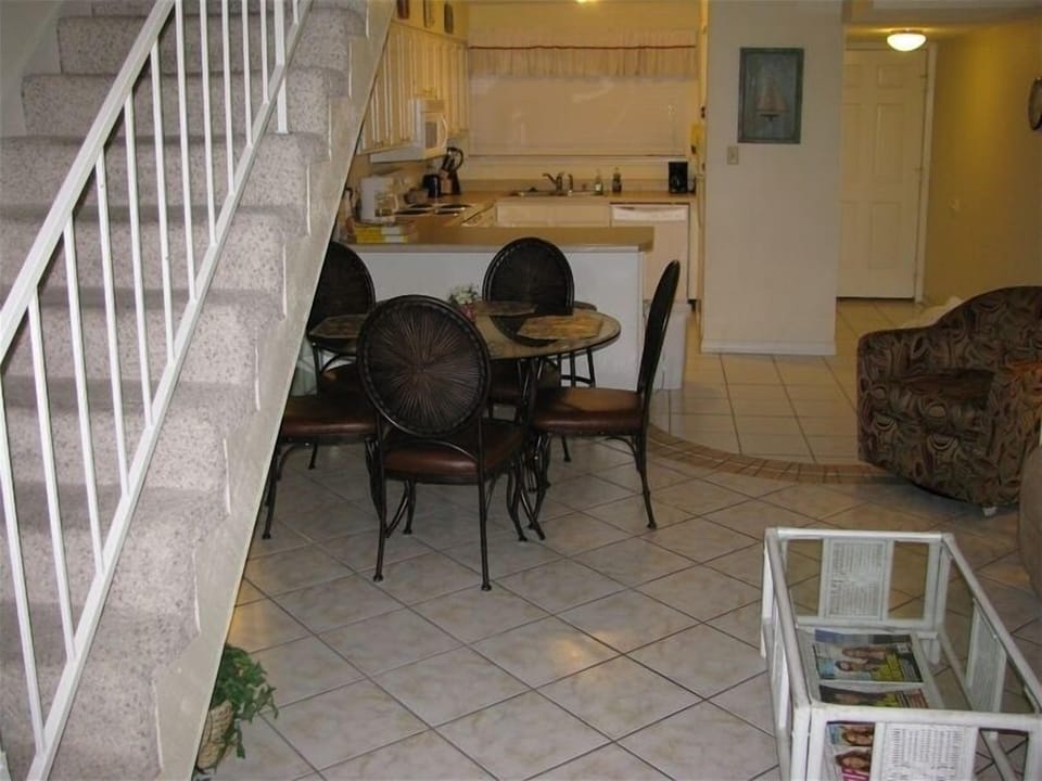 Stairs to loft, Dining, and Kitchen view
