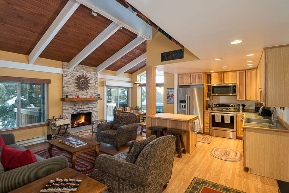 Open Cathedral Ceiling Living Area With Wood Burning Fireplace For Your Comfort