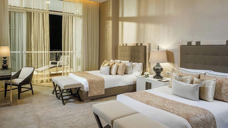 One of two bedrooms with two double beds