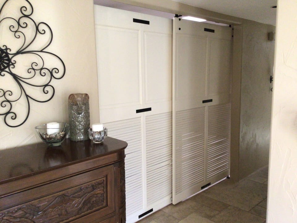 Barn doors on the den offer privacy 