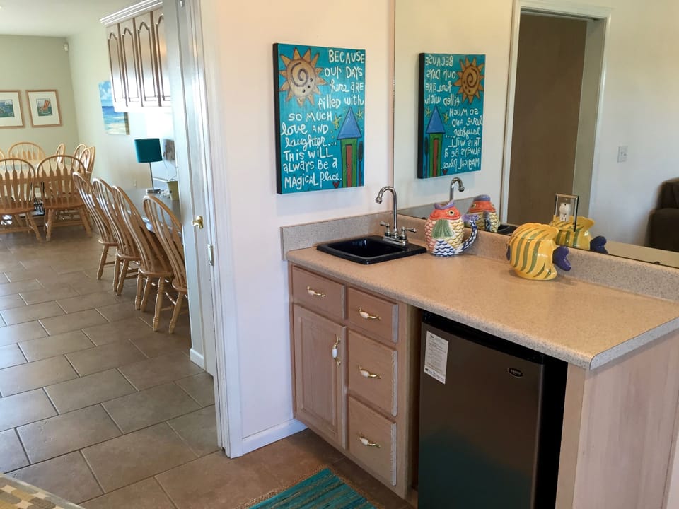 wet bar with mini-frig that connects southern / northern living areas