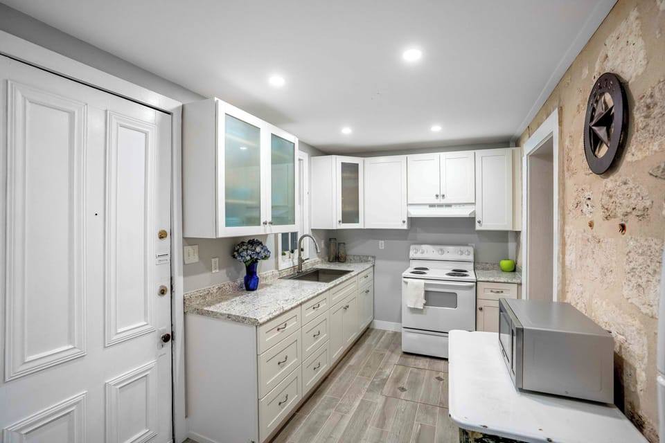 Newly renovated kitchen! Fully stocked to make a simple meal or enjoy take out. 