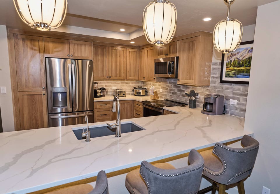 Fully equipped kitchen for your food prep needs and instant hot water at sink!