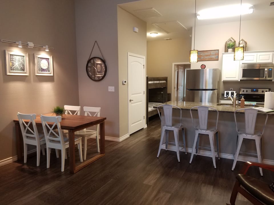 Great open floor plan. Dining table on left, kitchen to the right. 