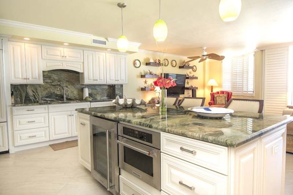 Kitchen features high end oven, microwave, refrigerator, dish washer