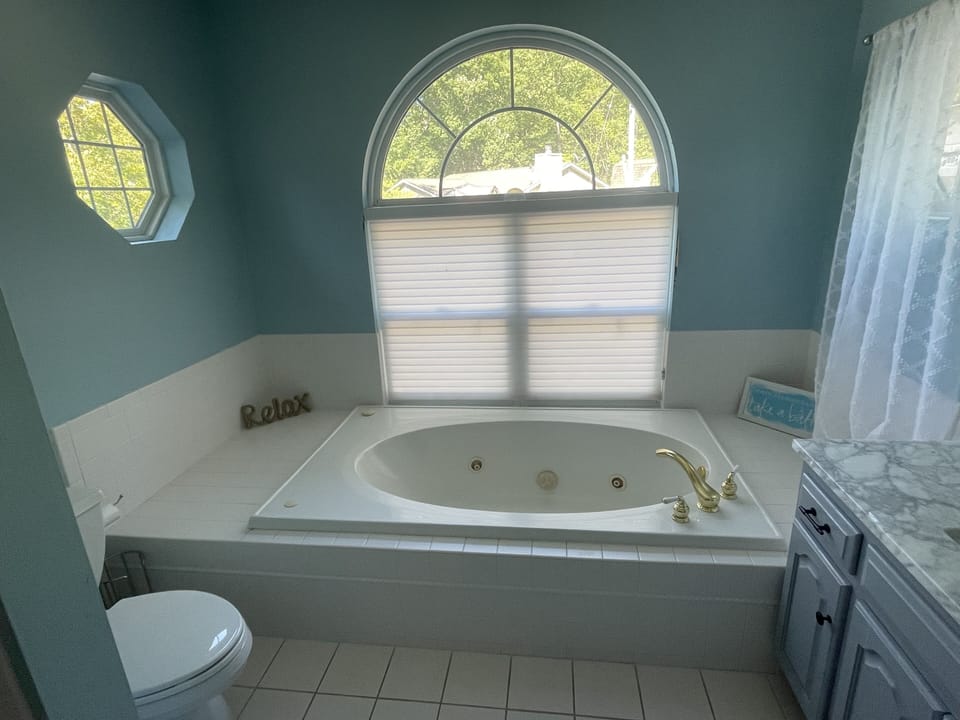 Large jetted tub in upstairs bathroom.
