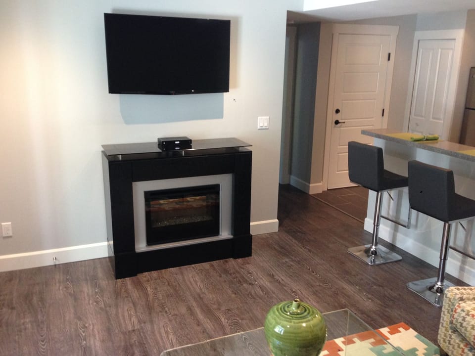 Electric fire; wall-mounted large flat screen HDTV with cable plus Netflix