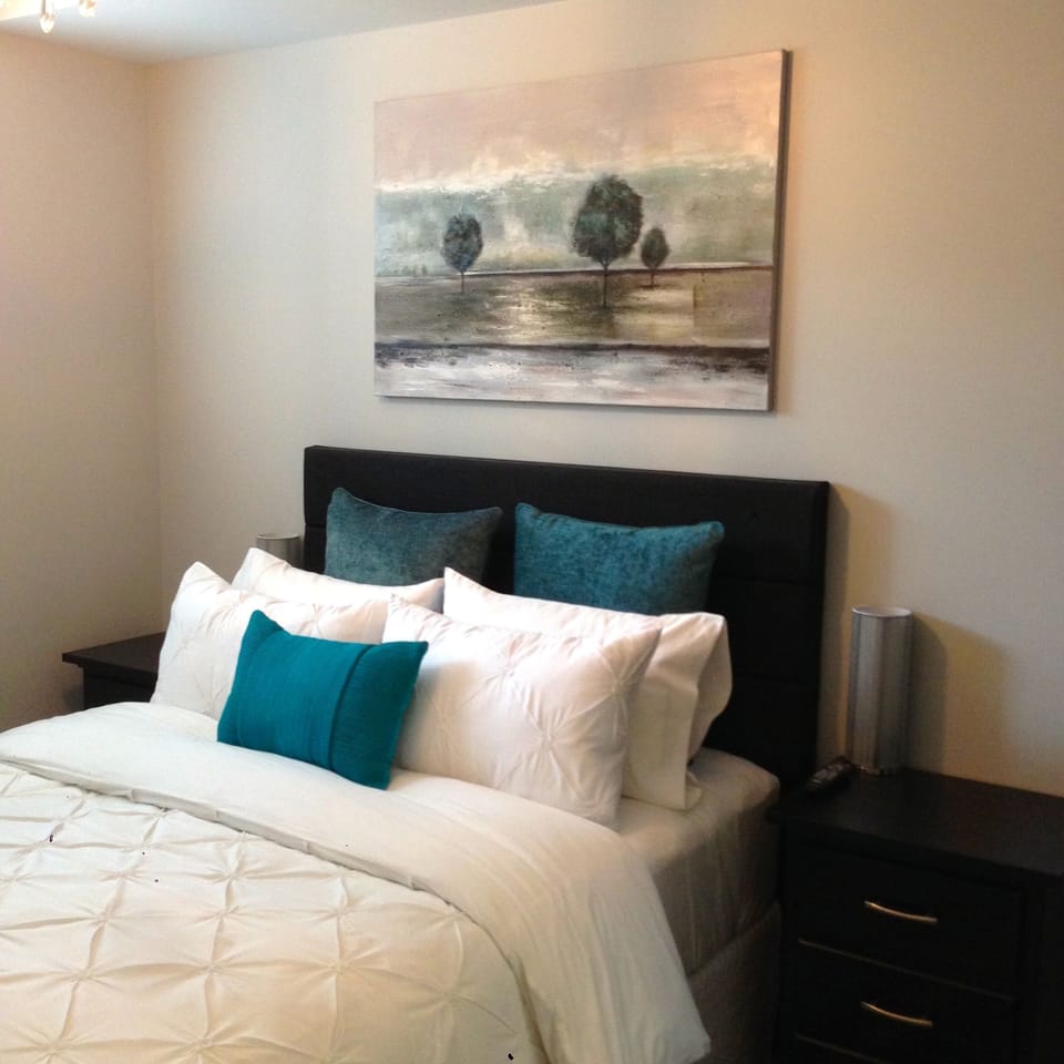 Very comfortable queen pillow-top master bed. Lots of hanging and drawer space.