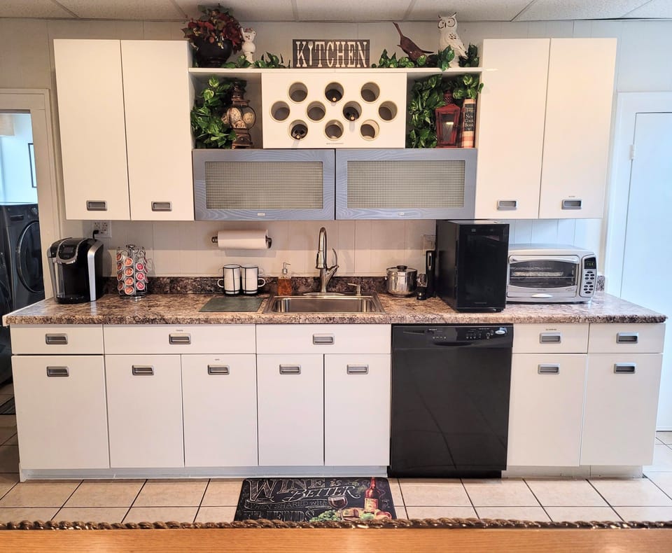 Beautiful kitchen with wine cooler, toaster oven, and Keurig!