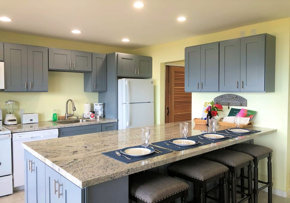 Granite counters and plenty of cabinets.