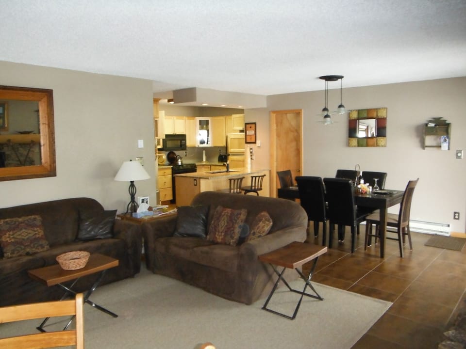 Living room with view of dining room and kitchen