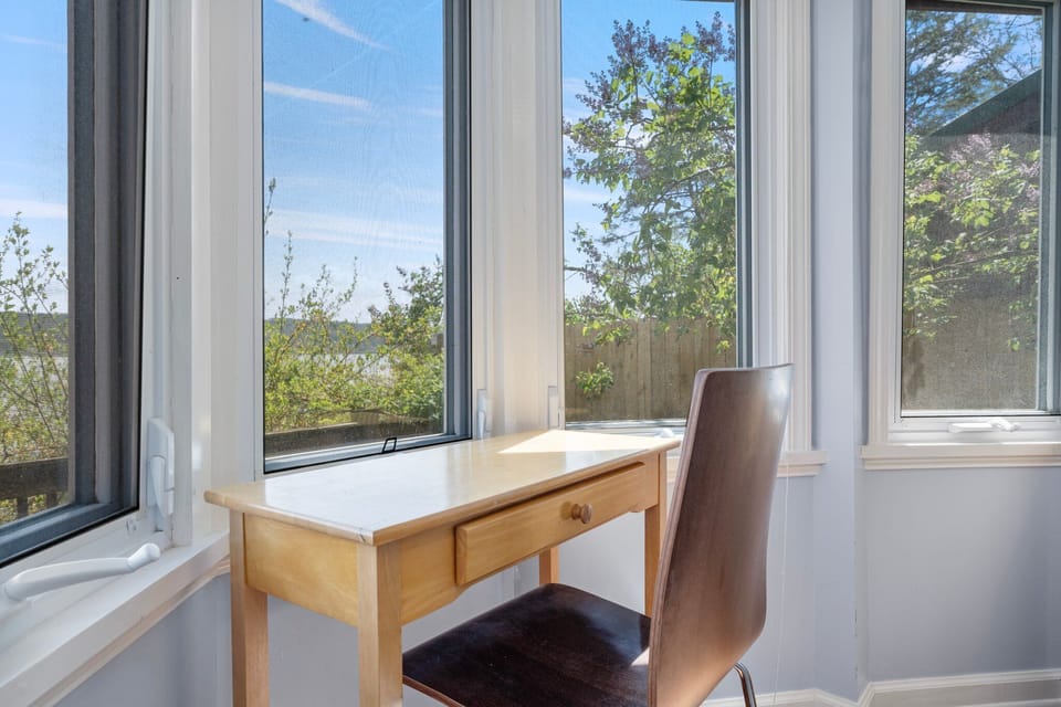 Small desk in lower bedroom for dedicated workspace.