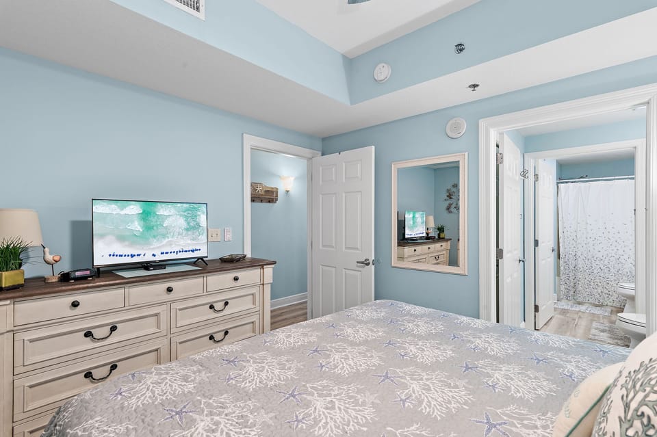 Private 1/2 bath with clothing closet including ironing board and iron.