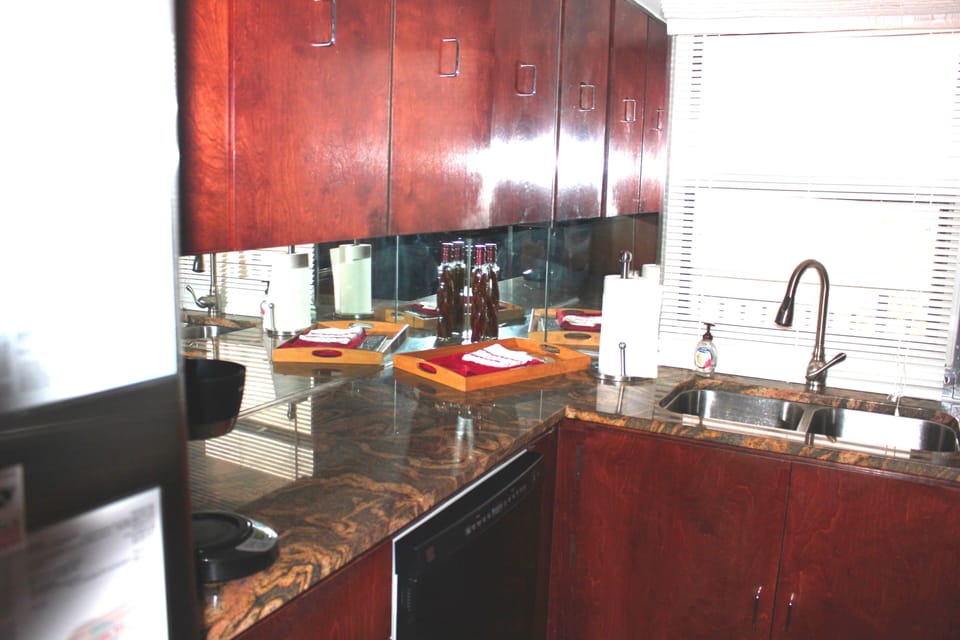 Galley kitchen with granite countertops and a view of Santa Rosa Sound.