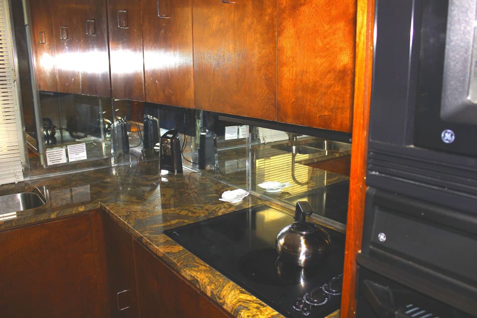 Kitchen equipped to accommodate preparation of snacks or gourmet meals.