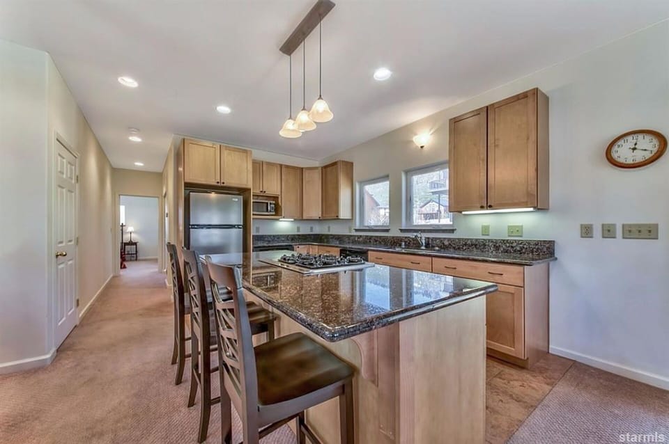 Gourmet open kitchen with breakfast bar