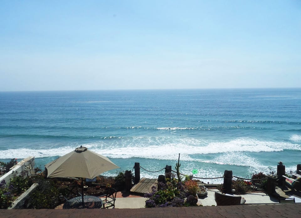 View from Master bedroom over patio below. Listen to the waves!